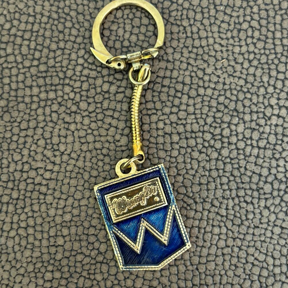 Wrangler Vintage keychain featuring a blue and gold design
